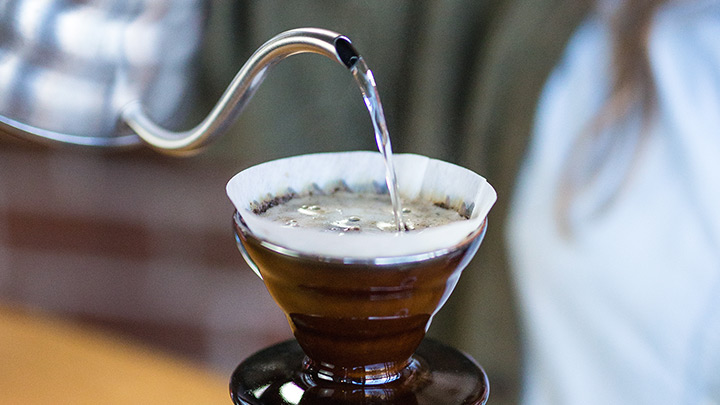 Pour the remaining water. The optimal coffee-to-water-ratio for pour over coffee is 1:15.